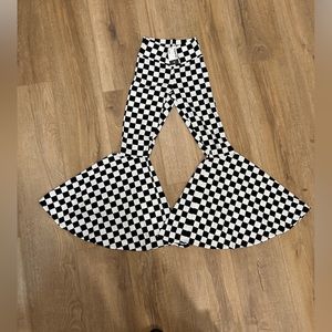Black/white checkered bell bottoms from Coquetry Clothing, black light reactive